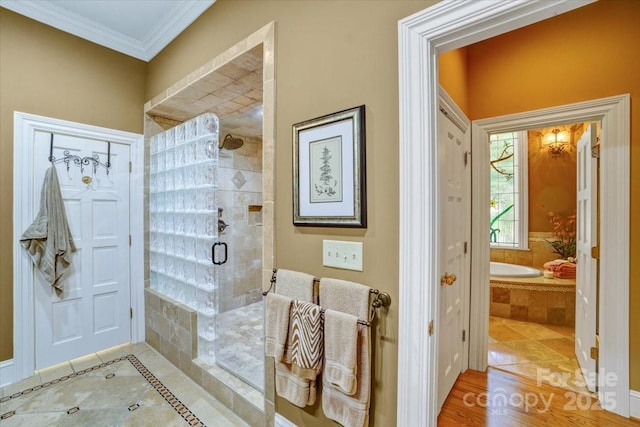 517 Kingsdown Ct, Waxhaw, NC 28173 - bathroom with crown molding, tiled shower, a garden tub, and tile patterned flooring