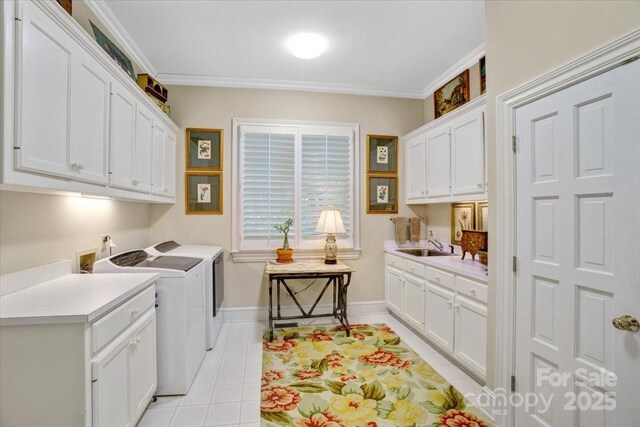 517 Kingsdown Ct, Waxhaw, NC 28173 - washroom with independent washer and dryer, cabinet space, light tile patterned floors, and crown molding