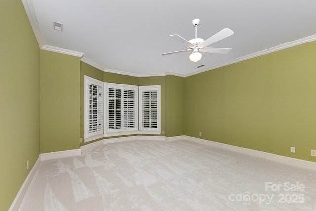 517 Kingsdown Ct, Waxhaw, NC 28173 - spare room featuring ceiling fan, ornamental molding, and carpet