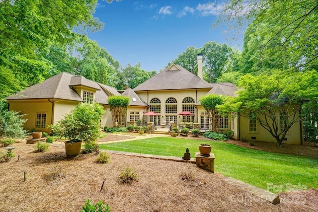 517 Kingsdown Ct, Waxhaw, NC 28173 - rear view of house featuring french doors, a lawn, and stucco siding