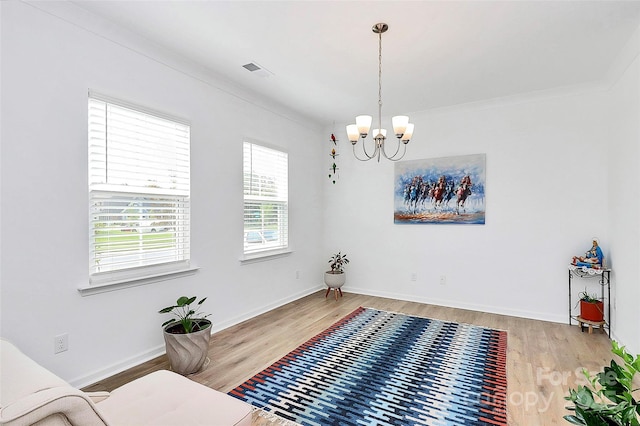 13140 Sudwick Ln, Charlotte, NC 28278 - sitting room featuring wood finished floors, a chandelier, and baseboards