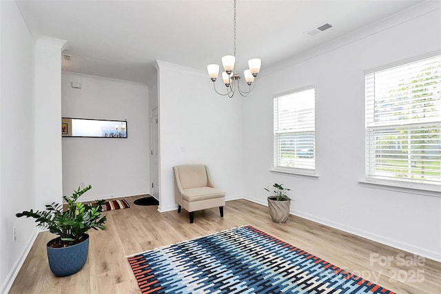 13140 Sudwick Ln, Charlotte, NC 28278 - living area with light wood-type flooring, healthy amount of natural light, a chandelier, baseboards, and ornamental molding