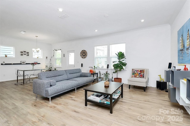 13140 Sudwick Ln, Charlotte, NC 28278 - living area with crown molding, a chandelier, light wood-style floors, recessed lighting, and baseboards