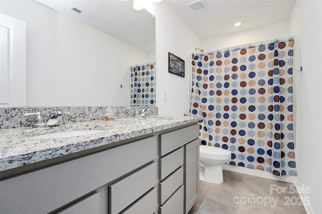 13140 Sudwick Ln, Charlotte, NC 28278 - bathroom with double vanity, toilet, tile patterned flooring, and a shower with shower curtain