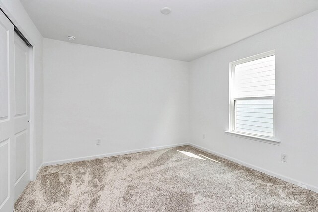 13140 Sudwick Ln, Charlotte, NC 28278 - unfurnished bedroom featuring carpet, baseboards, and a closet