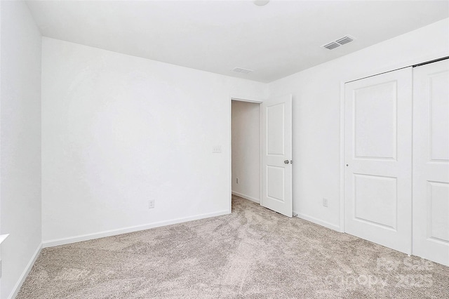 13140 Sudwick Ln, Charlotte, NC 28278 - unfurnished bedroom featuring carpet floors, baseboards, and a closet