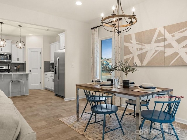 12016 Basking Dr, Charlotte, NC 28214 - dining room with a chandelier, recessed lighting, light wood-style floors, and baseboards