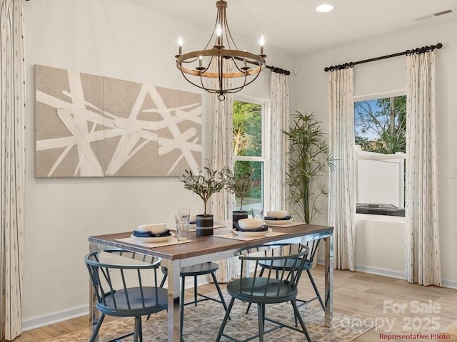 12016 Basking Dr, Charlotte, NC 28214 - dining space featuring light wood-type flooring, a chandelier, baseboards, and recessed lighting
