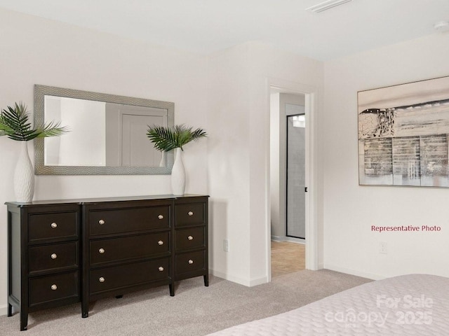 12016 Basking Dr, Charlotte, NC 28214 - bedroom featuring light carpet and baseboards