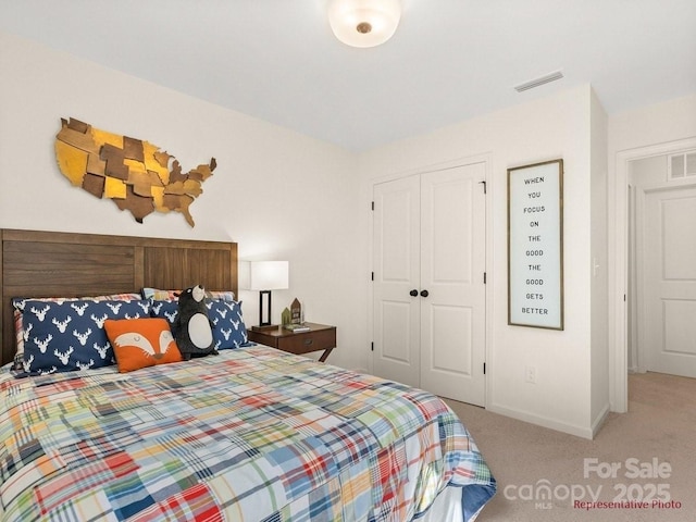12016 Basking Dr, Charlotte, NC 28214 - bedroom featuring carpet floors, a closet, and baseboards