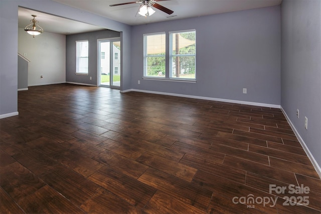 7623 Monarch Birch Ln, Charlotte, NC 28215 - spare room with ceiling fan, dark wood-style flooring, and baseboards
