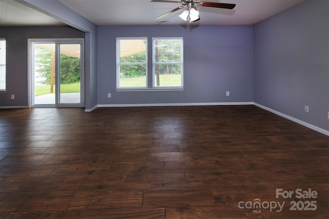 7623 Monarch Birch Ln, Charlotte, NC 28215 - spare room with ceiling fan, dark wood-style floors, and baseboards
