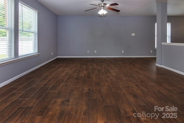 7623 Monarch Birch Ln, Charlotte, NC 28215 - empty room with dark wood-type flooring, ceiling fan, and baseboards