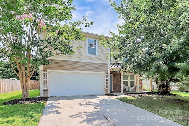 1817 Tradd Ave, Clover, SC 29710 - view of front of home with an attached garage, driveway, brick siding, and covered porch