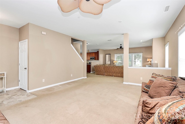 1817 Tradd Ave, Clover, SC 29710 - living room featuring a ceiling fan, light carpet, and baseboards