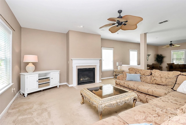 1817 Tradd Ave, Clover, SC 29710 - living area featuring ceiling fan, a fireplace with flush hearth, baseboards, and light carpet
