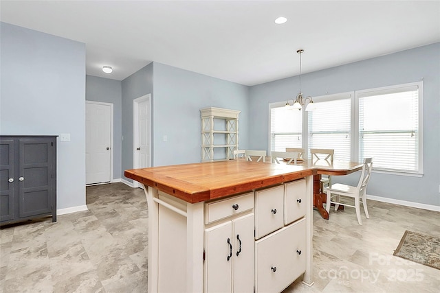 1817 Tradd Ave, Clover, SC 29710 - kitchen with a chandelier, wood counters, plenty of natural light, and baseboards