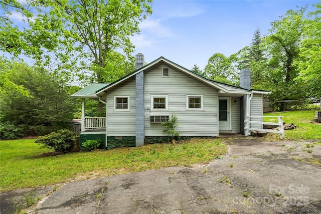 220 W College St, Black Mountain, NC 28711 - back of house featuring a chimney and a yard
