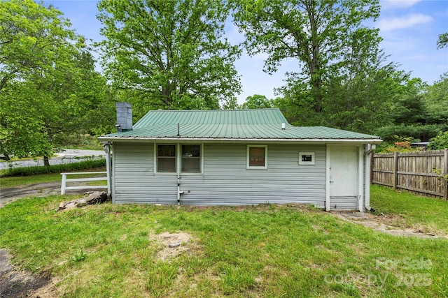 220 W College St, Black Mountain, NC 28711 - rear view of house featuring a chimney and a metal roof