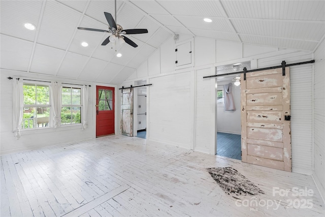 220 W College St, Black Mountain, NC 28711 - entryway featuring a barn door, wood-type flooring, a ceiling fan, and high vaulted ceiling