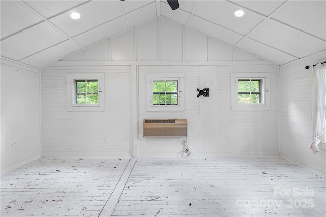 220 W College St, Black Mountain, NC 28711 - interior space featuring an AC wall unit, vaulted ceiling, plenty of natural light, wood finished floors, and recessed lighting