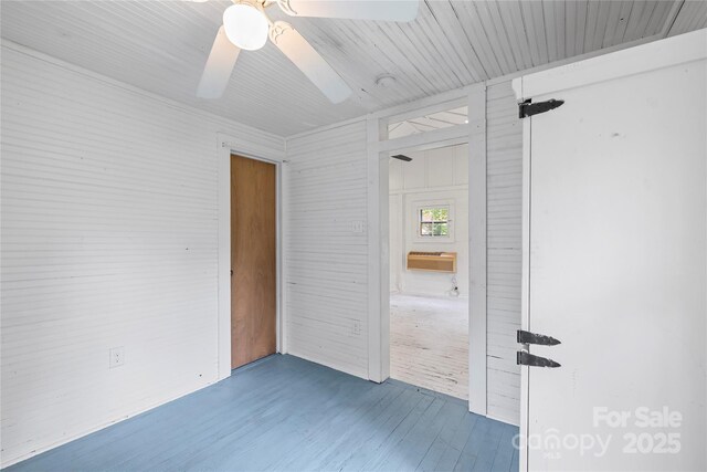 220 W College St, Black Mountain, NC 28711 - unfurnished bedroom featuring wood finished floors and a ceiling fan