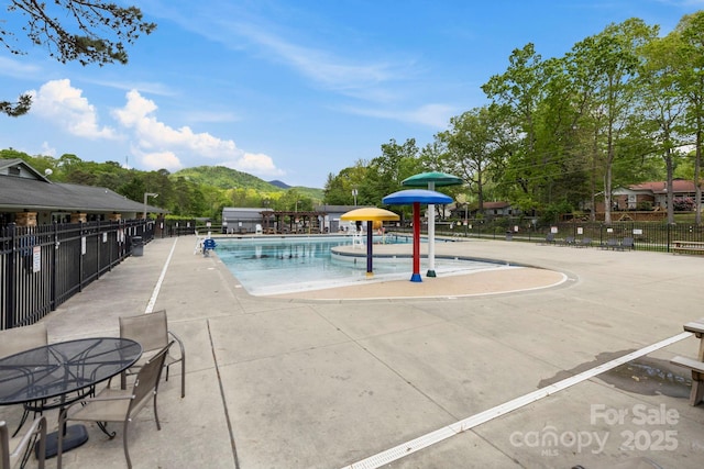 220 W College St, Black Mountain, NC 28711 - community pool featuring a mountain view and a patio area