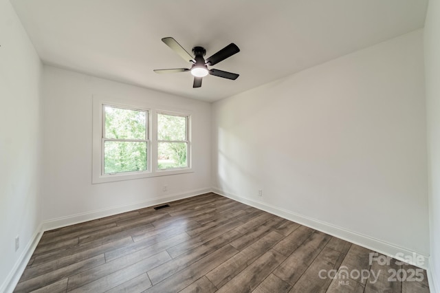 3608 Crestridge Dr, Charlotte, NC 28217 - spare room with dark wood finished floors, a ceiling fan, and baseboards