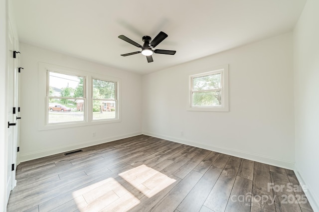 3608 Crestridge Dr, Charlotte, NC 28217 - empty room featuring healthy amount of natural light, wood finished floors, and ceiling fan