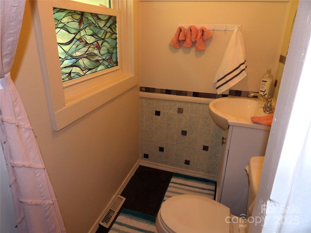 345 Old Toll Cir, Black Mountain, NC 28711 - bathroom featuring vanity, tile walls, a wainscoted wall, and toilet