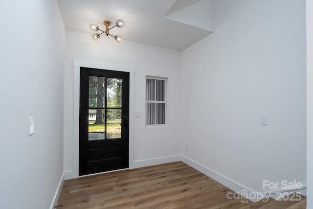 1520 Enochville Rd, Kannapolis, NC 28081 - entryway with a chandelier, wood finished floors, and baseboards