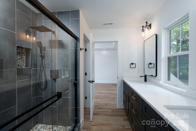 1520 Enochville Rd, Kannapolis, NC 28081 - bathroom with wood finished floors, double vanity, and a shower stall
