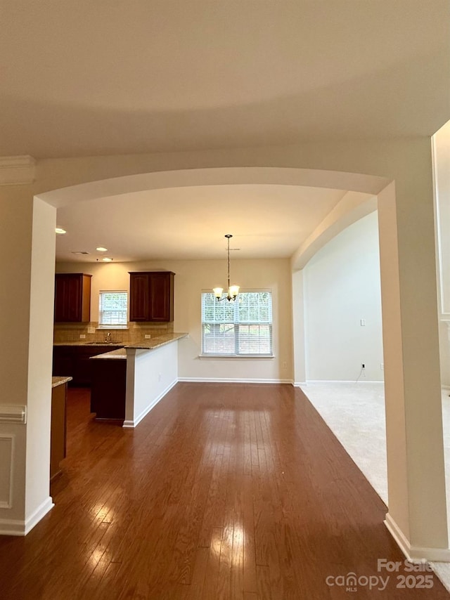 1304 Ridge Haven Rd, Waxhaw, NC 28173 - kitchen featuring dark wood-style floors, decorative backsplash, healthy amount of natural light, and recessed lighting