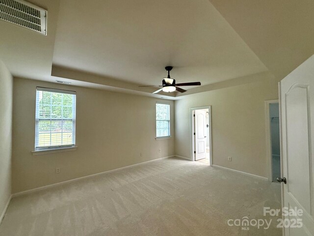 1304 Ridge Haven Rd, Waxhaw, NC 28173 - unfurnished room featuring carpet, a ceiling fan, and a tray ceiling