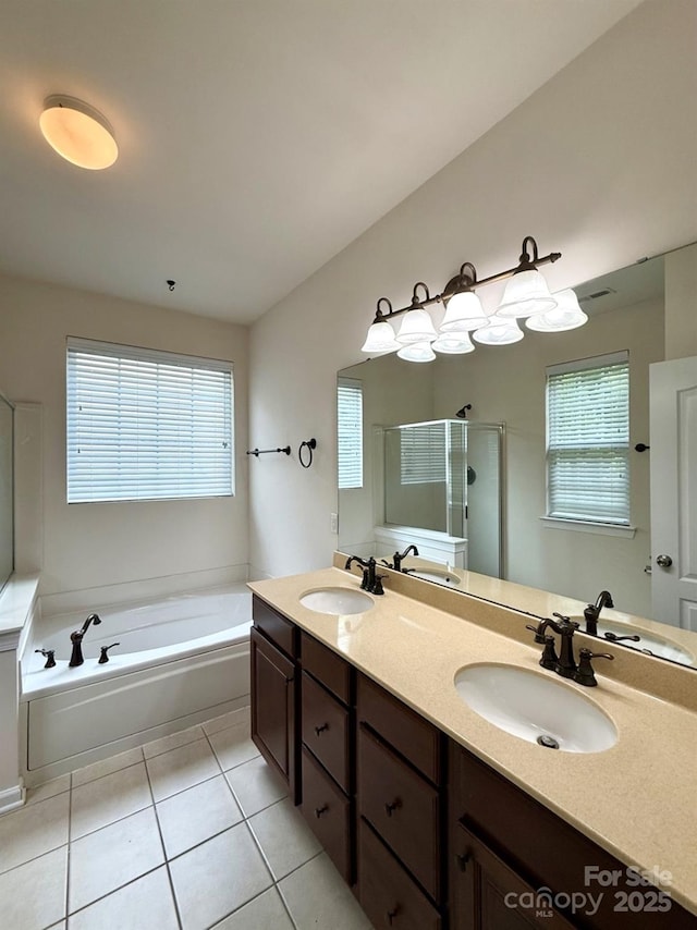 1304 Ridge Haven Rd, Waxhaw, NC 28173 - full bathroom featuring a garden tub, double vanity, tile patterned flooring, and a stall shower