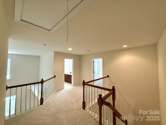 1304 Ridge Haven Rd, Waxhaw, NC 28173 - corridor featuring light colored carpet, an upstairs landing, attic access, recessed lighting, and baseboards