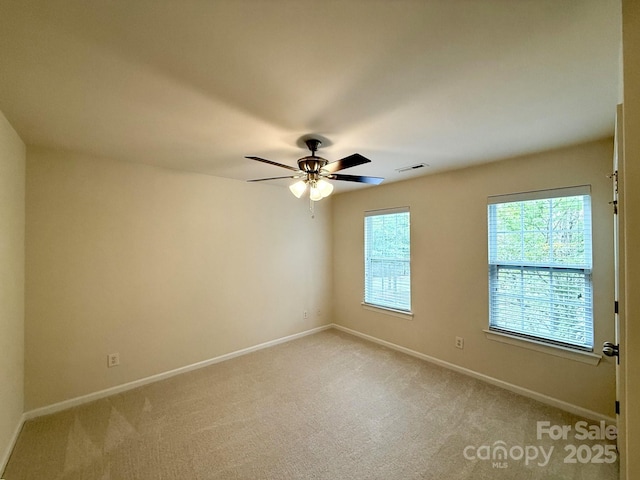 1304 Ridge Haven Rd, Waxhaw, NC 28173 - spare room featuring light colored carpet, baseboards, and ceiling fan