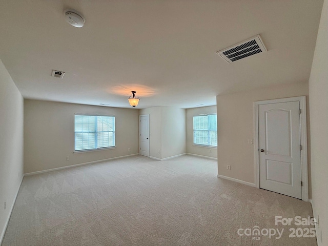 1304 Ridge Haven Rd, Waxhaw, NC 28173 - spare room featuring light carpet, healthy amount of natural light, and a smoke detector