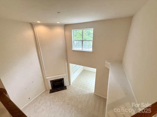 1304 Ridge Haven Rd, Waxhaw, NC 28173 - unfurnished living room with a high end fireplace, carpet floors, and recessed lighting