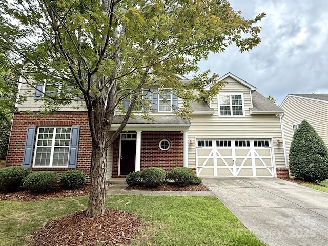 1304 Ridge Haven Rd, Waxhaw, NC 28173 - traditional-style home featuring concrete driveway, a garage, brick siding, and a front lawn