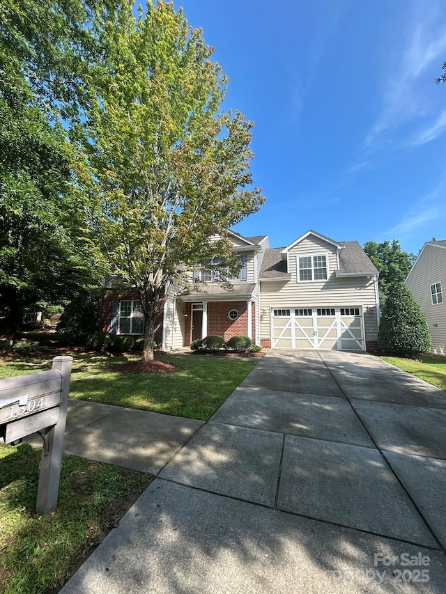 1304 Ridge Haven Rd, Waxhaw, NC 28173 - view of property hidden behind natural elements with driveway, a front yard, and an attached garage