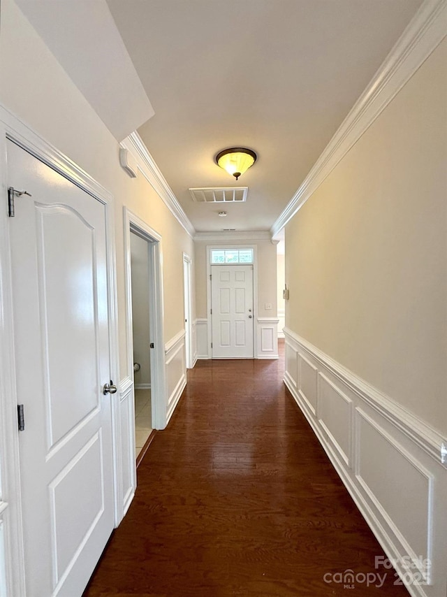 1304 Ridge Haven Rd, Waxhaw, NC 28173 - hall featuring a decorative wall, crown molding, dark wood-style floors, and wainscoting