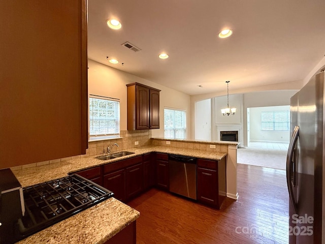 1304 Ridge Haven Rd, Waxhaw, NC 28173 - kitchen with appliances with stainless steel finishes, healthy amount of natural light, dark wood-style flooring, backsplash, and recessed lighting