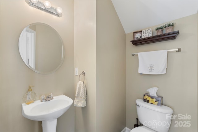 4006 Centerview Dr, Indian Trail, NC 28079 - half bathroom featuring toilet, a sink, and vaulted ceiling