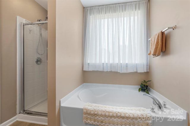 4006 Centerview Dr, Indian Trail, NC 28079 - bathroom with plenty of natural light, a bath, and a stall shower