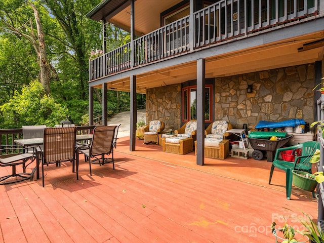 2981 Heath Peak Rd, Waynesville, NC 28785 - wooden deck with outdoor dining space and an outdoor living space