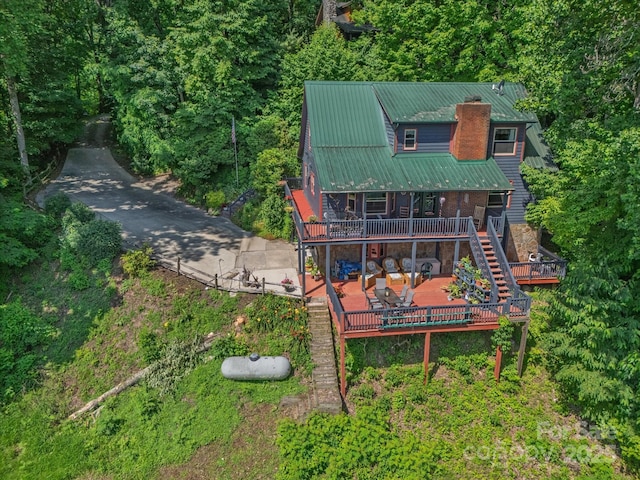 2981 Heath Peak Rd, Waynesville, NC 28785 - rear view of house with stairs, a deck, a patio area, a metal roof, and a chimney