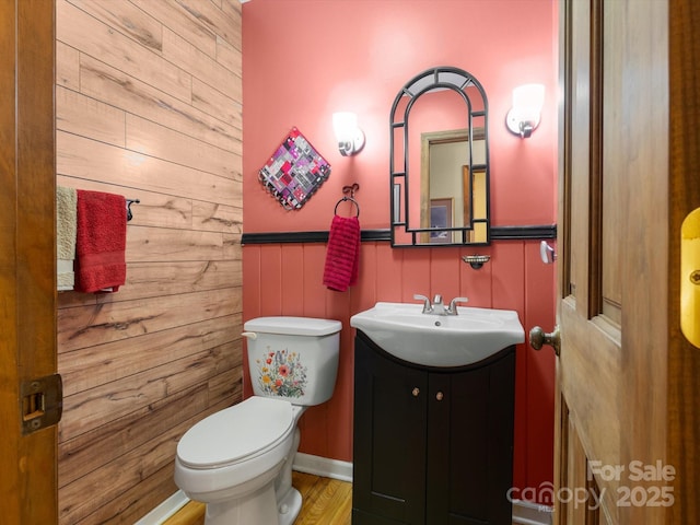 2981 Heath Peak Rd, Waynesville, NC 28785 - half bathroom with vanity, wood walls, and wood finished floors