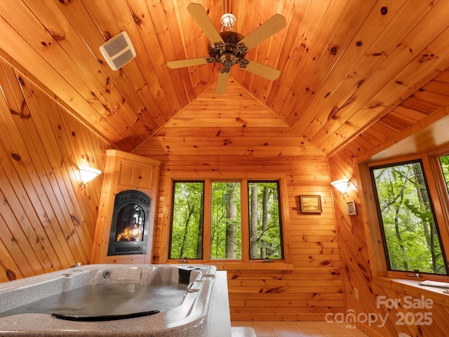 2981 Heath Peak Rd, Waynesville, NC 28785 - dining space with wooden ceiling, plenty of natural light, wooden walls, lofted ceiling, and ceiling fan