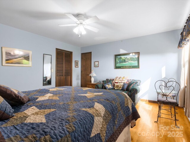 2981 Heath Peak Rd, Waynesville, NC 28785 - bedroom featuring light wood finished floors and a ceiling fan